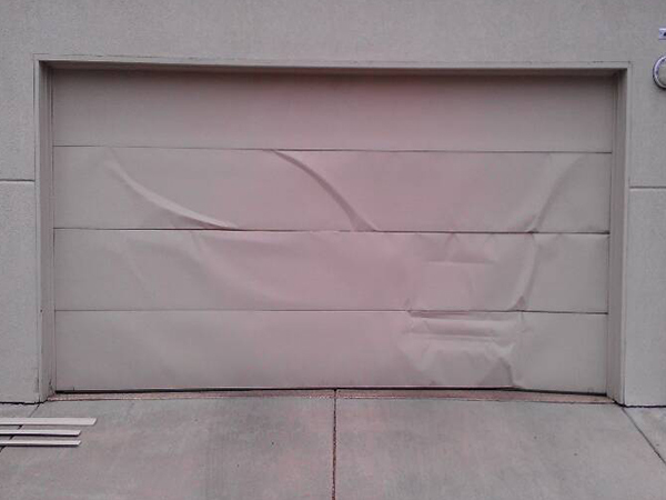 Dented and Damaged Garage Door Replacement Before